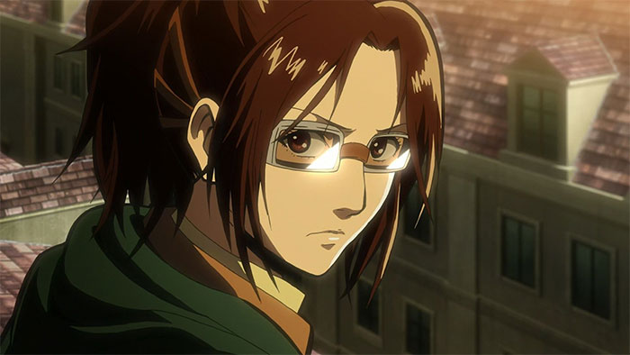 Female anime character with glasses gazing intently, set against a backdrop of buildings at sunset.