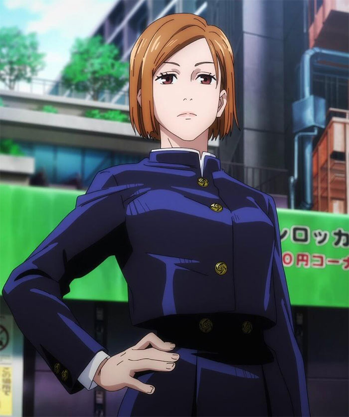 A confident female anime character standing with hand on hip in a blue uniform, popular among fans.