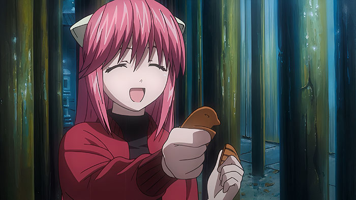Pink-haired anime character smiling, holding broken cookies in a forest.