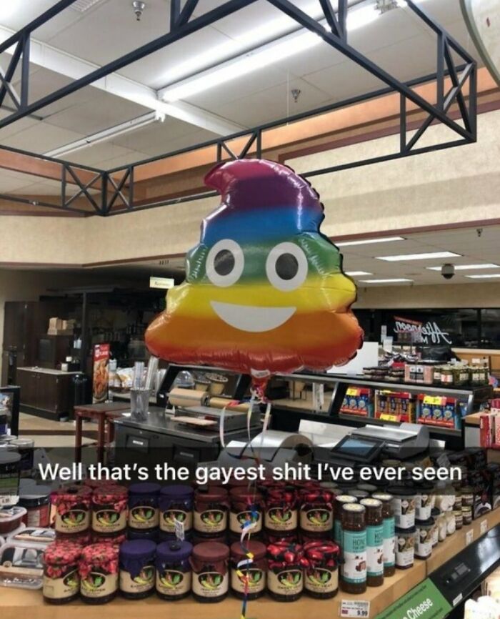 Rainbow emoji balloon in a store with a humorous caption about LGBTQ+ pride.