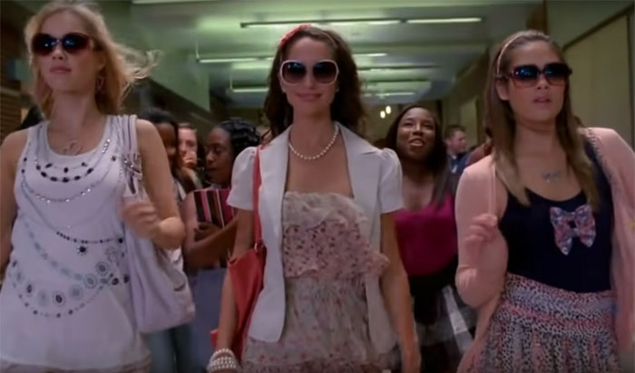 Three women wearing sunglasses walking confidently in a group, representing movies viewers couldn’t finish due to being bad.