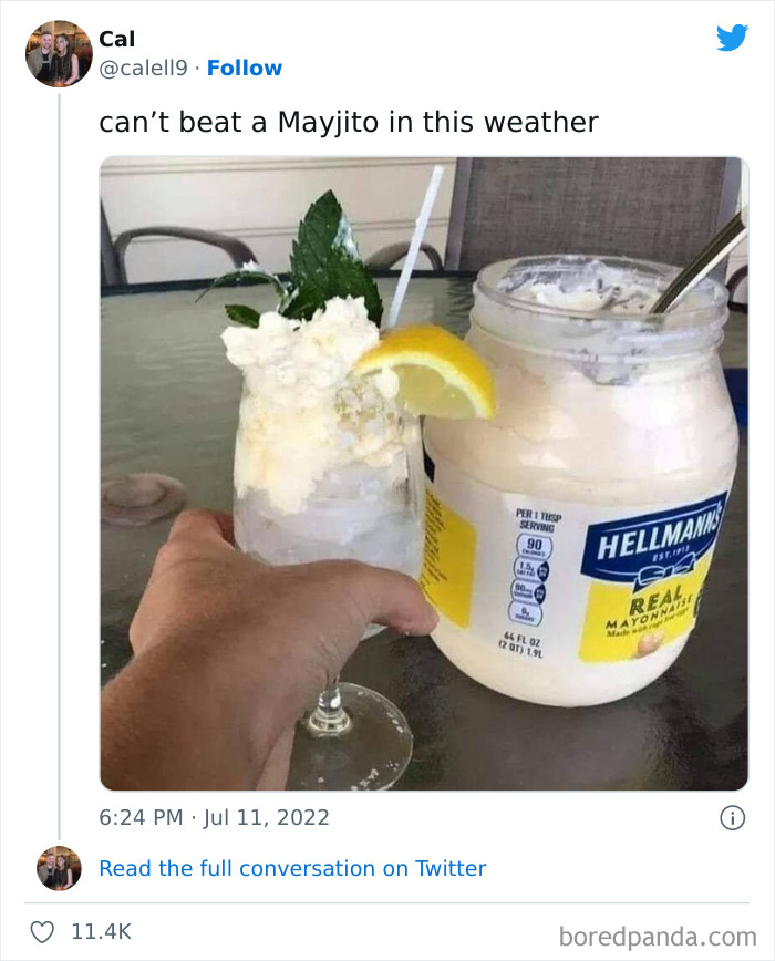 Hand holding a mojito glass garnished with lemon and mint next to a large jar of mayonnaise, an example of food with threatening auras.