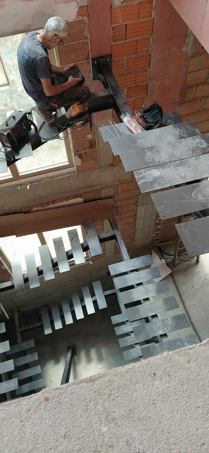 My Dad's Colleague Checking His Phone On The New Staircases They Built