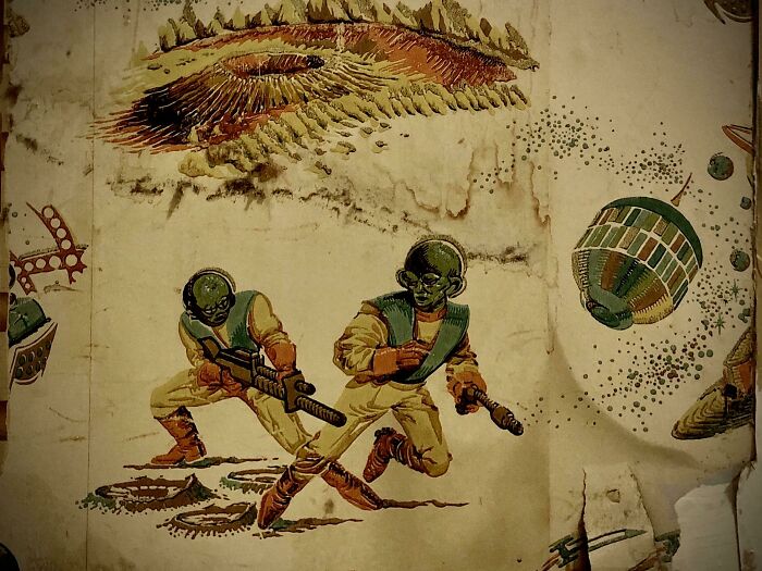 Took A Radiator Off The Wall To Decorate And Found This Ancient, Alien Invasion Wallpaper