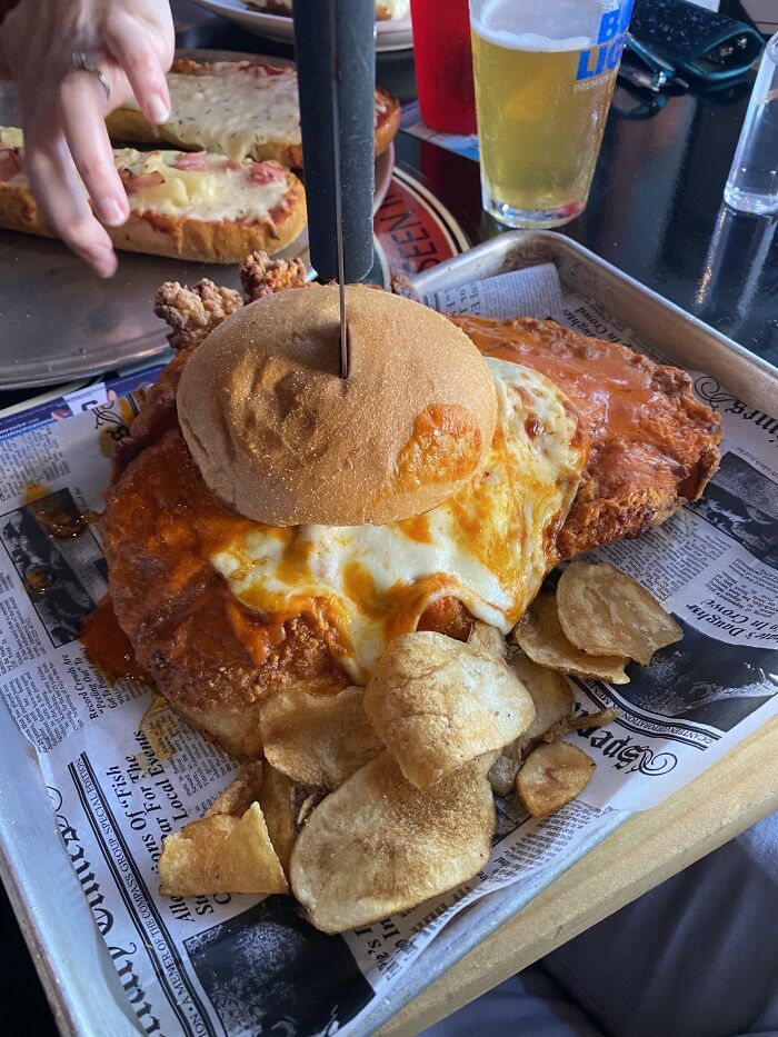 A Chicken Sandwich I Ordered That Was Impossible To Eat Normally. Didn’t Expect The Size. (Had More Chips On The Side)