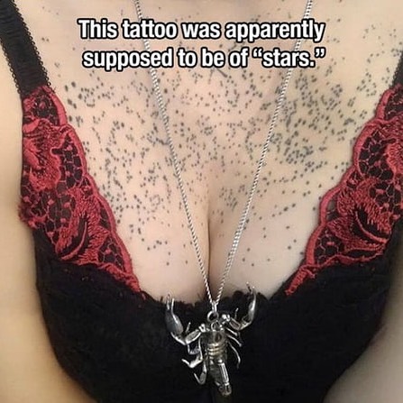 Lace bra and scorpion necklace with a poorly done tattoo intended to resemble stars.