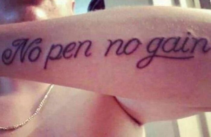 Tattoo fail on arm with text "No pen no gain" instead of intended phrase.