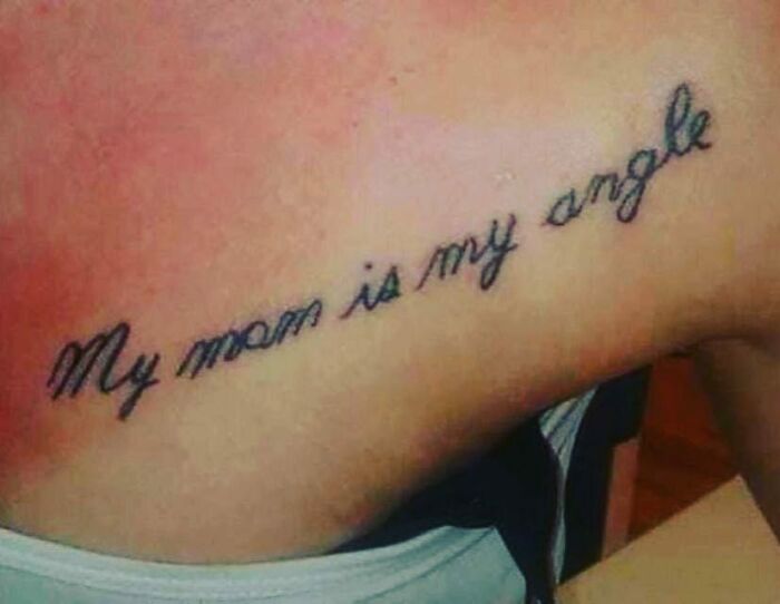 Tattoo fails: misspelled tattoo reads, "My mom is my angle" on upper chest.