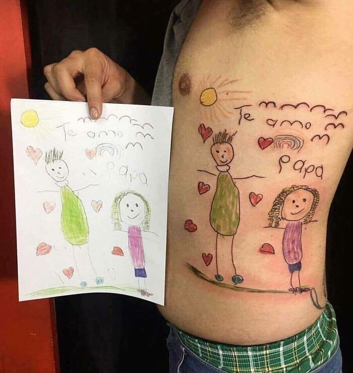 A person with a colorful tattoo replicating a child's drawing on their side.