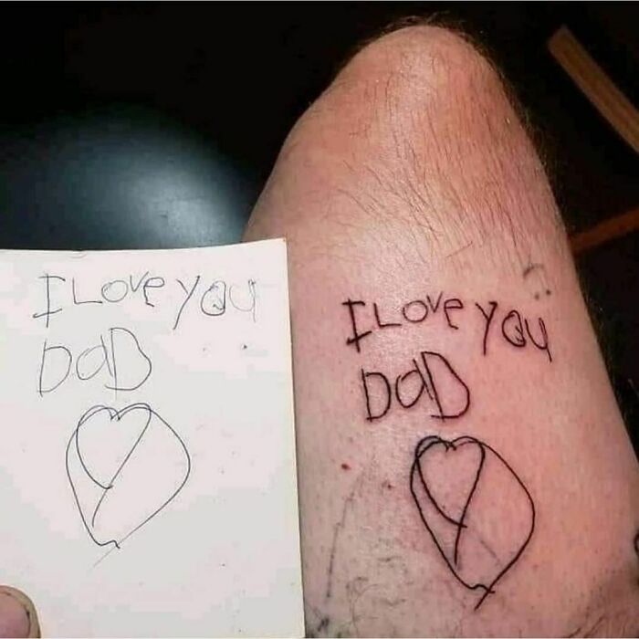 Child's handwriting tattoo with "I Love You Dad" and heart design.