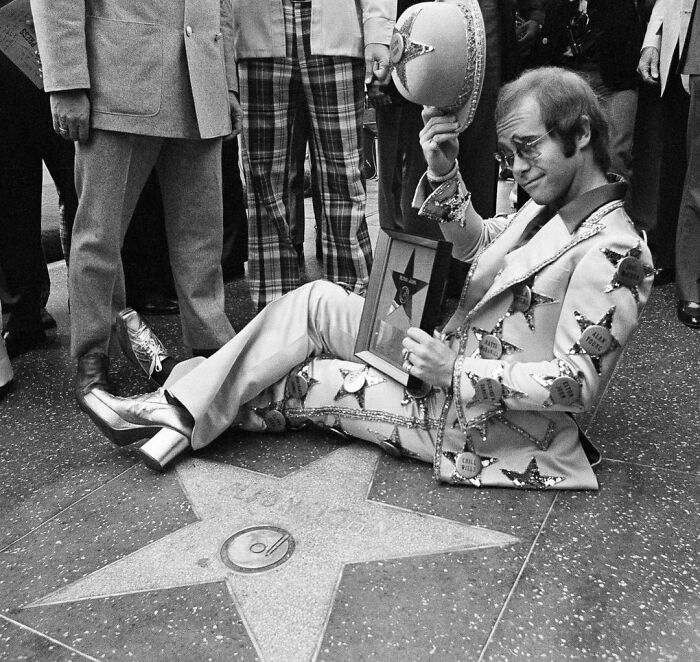 Elton John Posing After Having A Star Dedicated To Him On The Hollywood Walk Of Fame, 1975 (By Jeff Robbins)