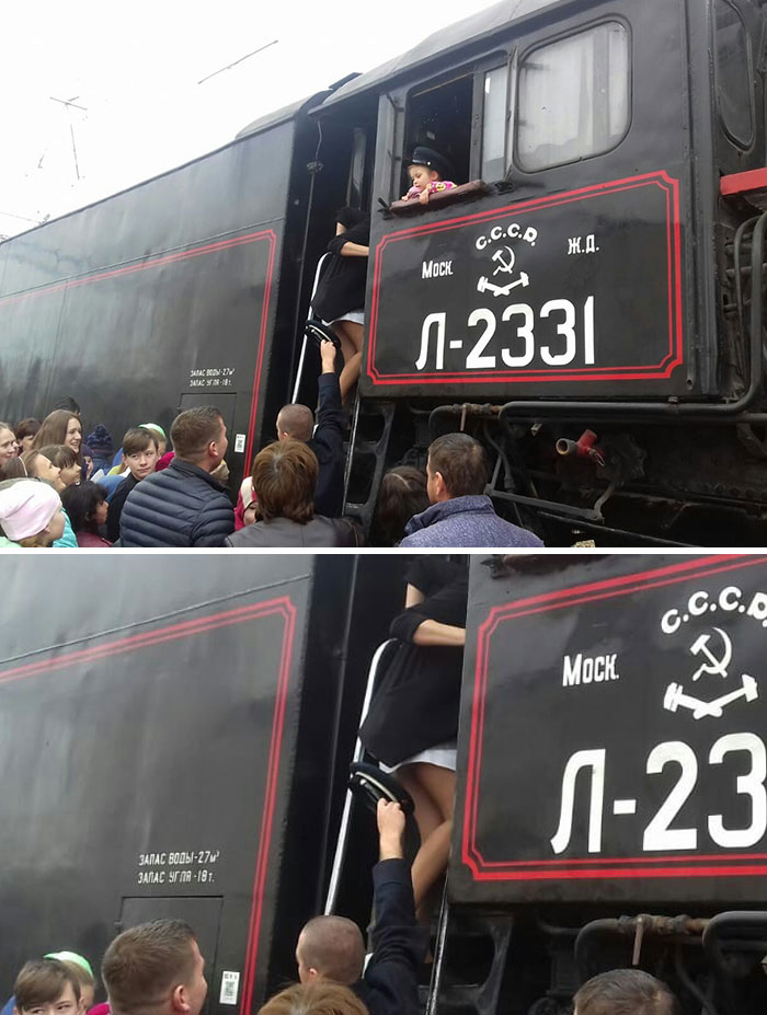 A Train Driver Helping A Passenger