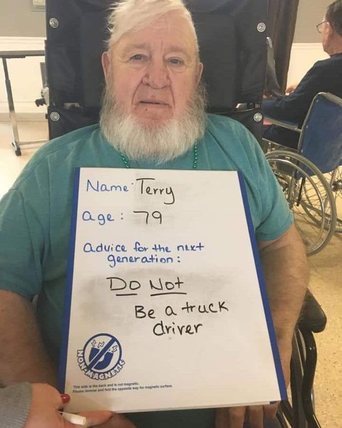 Elderly man holding a sign giving advice against being a truck driver, featured in bad drivers Facebook group posts.