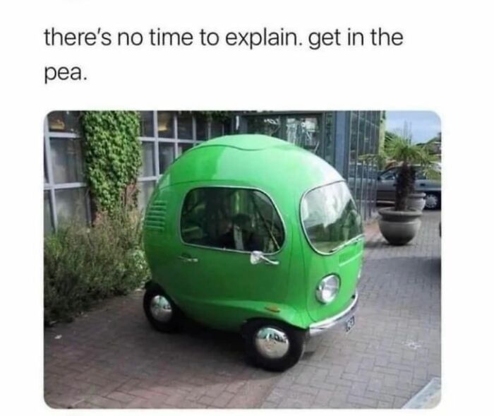 Small green car shaped like a pea on a sidewalk, showcasing a funny example of bad drivers from a popular Facebook group.