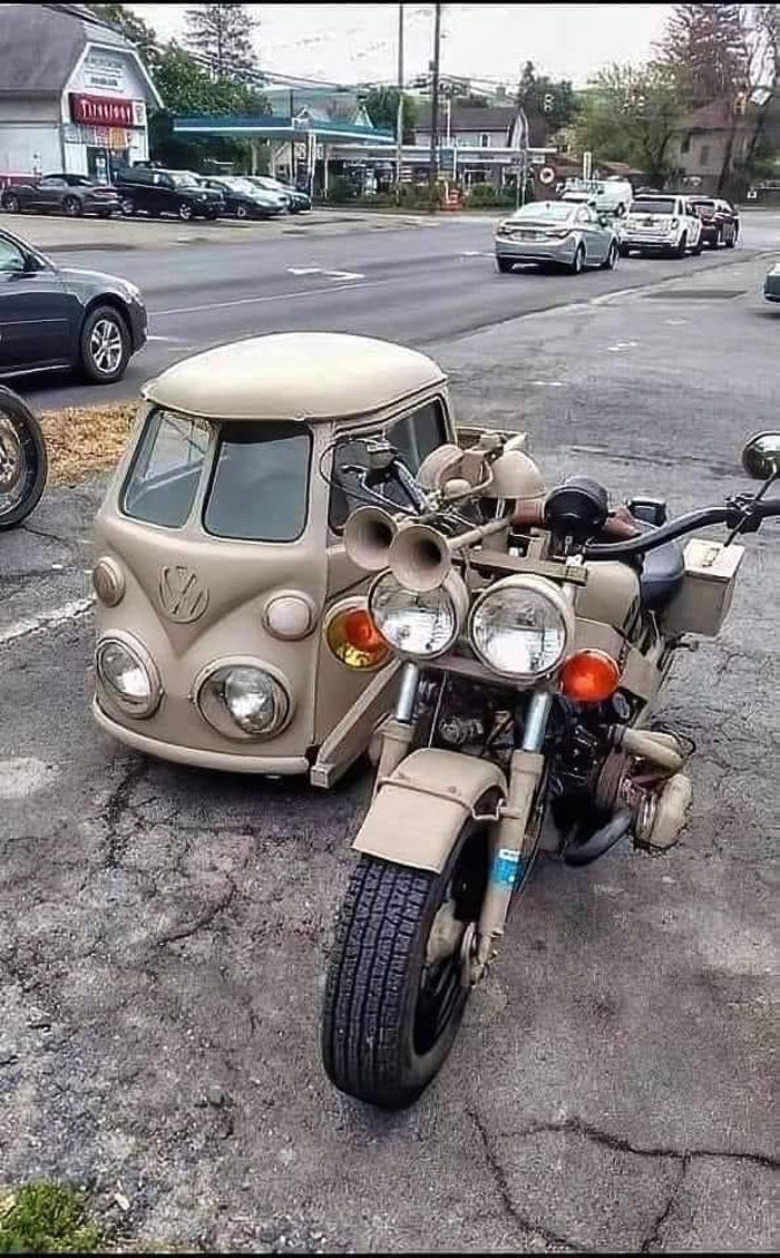 Motorcycle with a Volkswagen bus sidecar parked by the roadside, an example shared in bad drivers Facebook group.