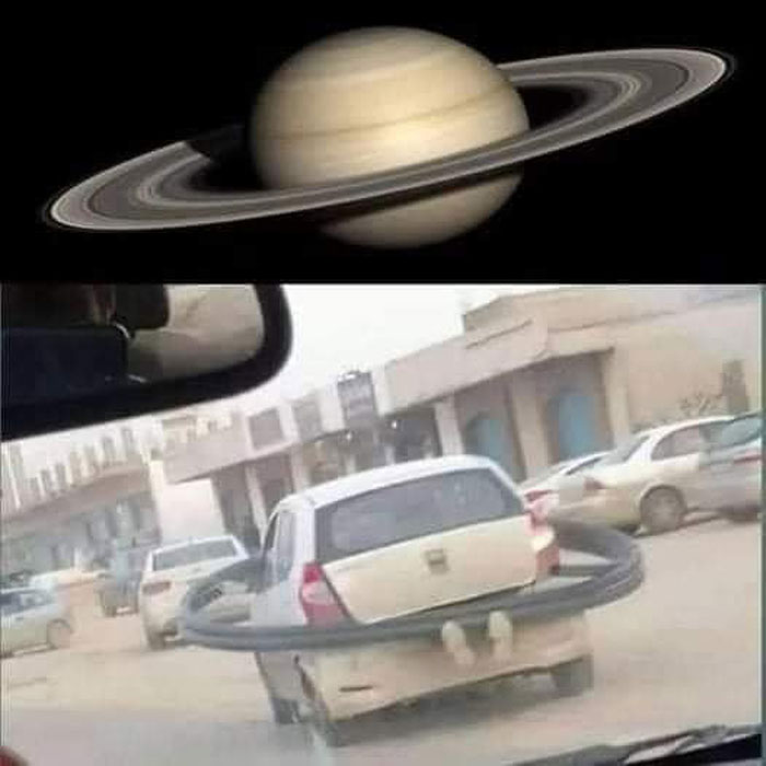 A car with a hula hoop attached to its rear, humorously resembling Saturn's rings, in a bad drivers Facebook group post.