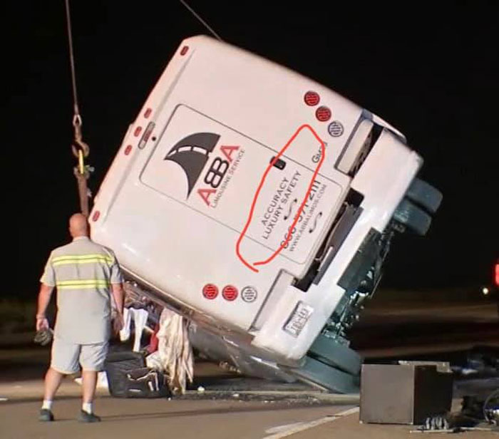 Large truck overturned on highway at night with a man standing nearby in a photo of bad drivers documented in a Facebook group.
