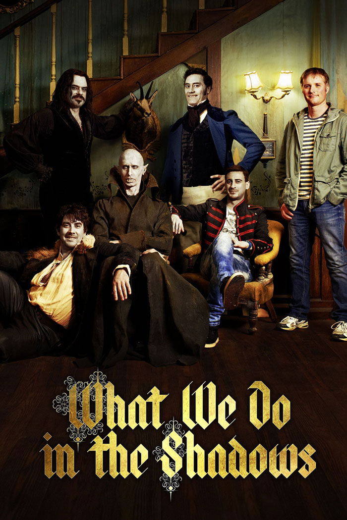 Cast of What We Do in the Shadows posing indoors, a popular horror comedy featured in top horror comedies.