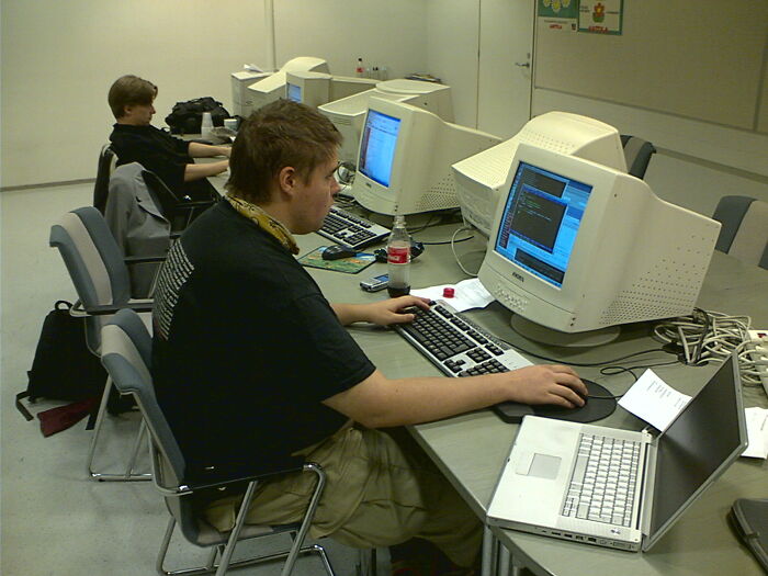People working at computers in an office setting; highlighting the "nobody wants to work" sentiment.