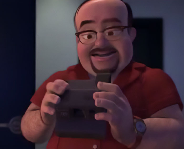 Al Mcwhiggin holding a camera 