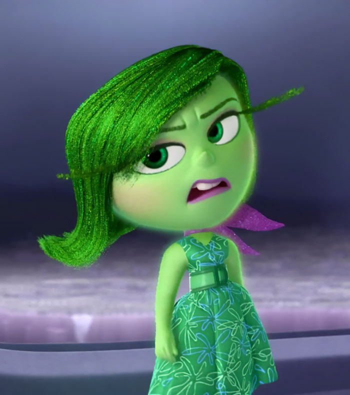 Disgust wearing green dress 