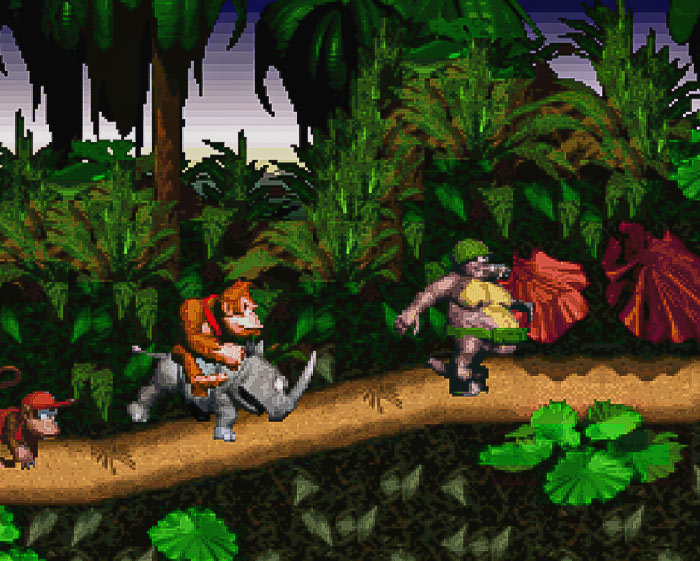 Retro video game scene with a monkey riding a rhinoceros through a jungle path.