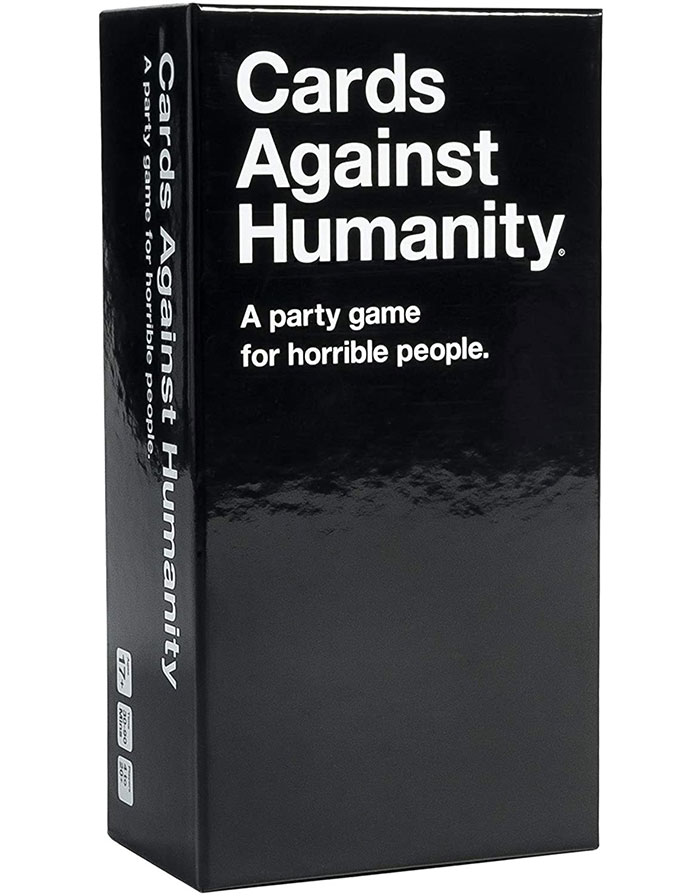 Cards Against Humanity party game box, a popular strategy board game for long cozy evenings with friends.