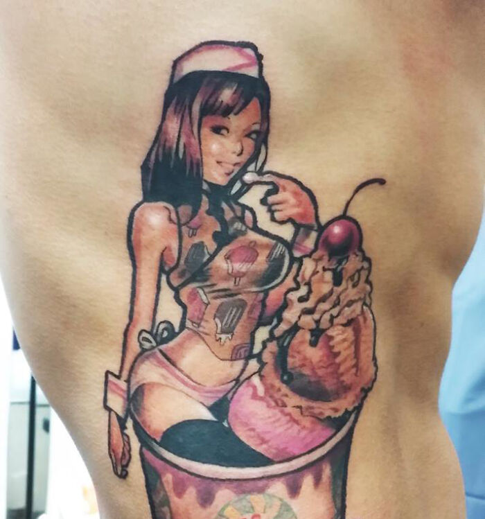Tattoo of a pin-up girl in ice cream on a person's side, considered a red flag design by some.