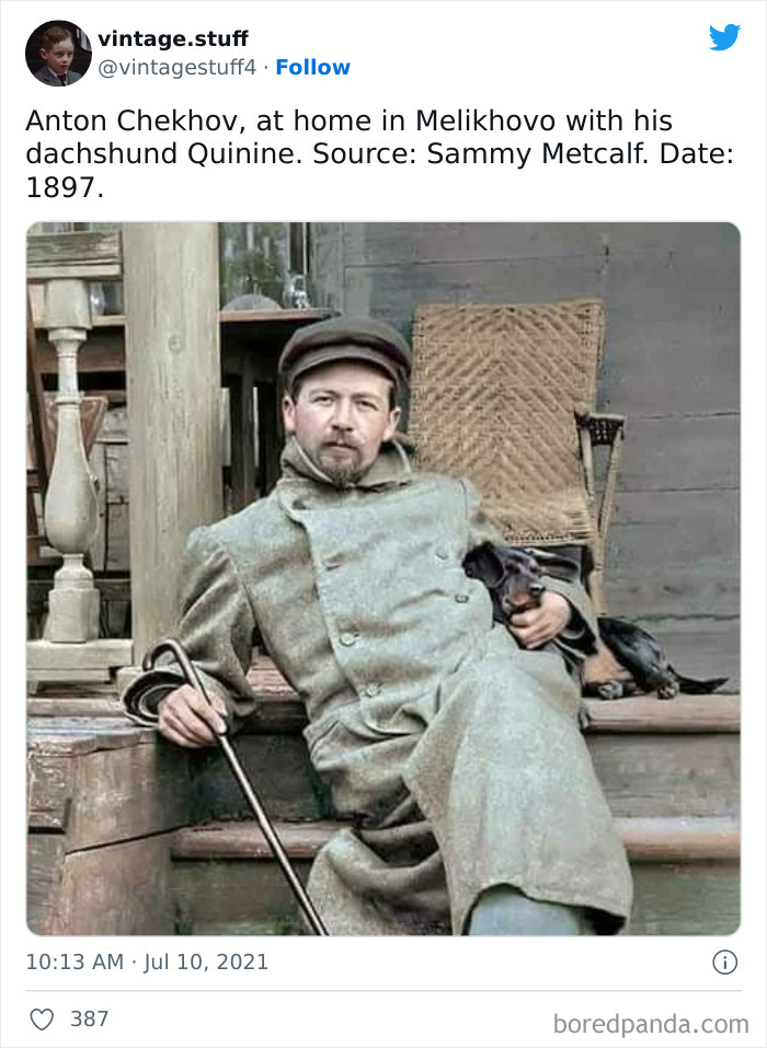 Anton Chekhov sitting on wooden steps at home with his dachshund in a colorized historical photo from 1897.