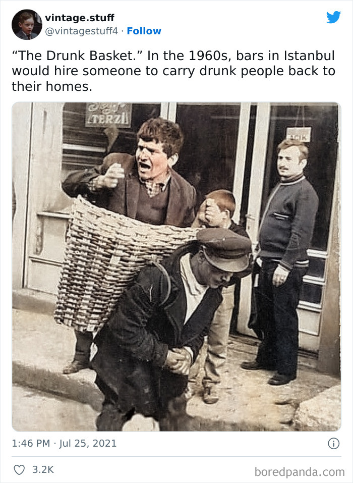 Colorized photo from the 1960s showing a man carrying a drunk person in a basket in Istanbul streets.