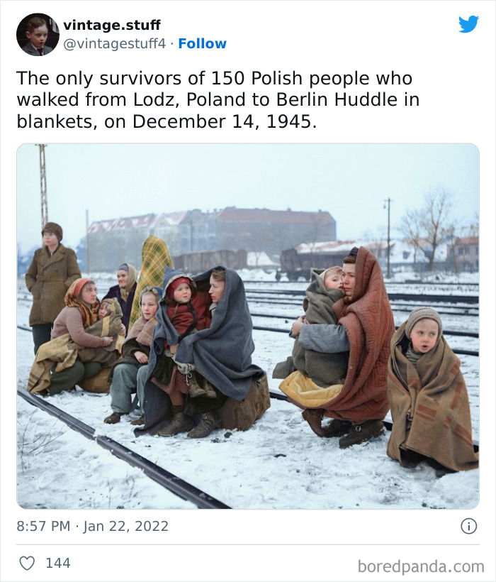 Colorized photo of Polish survivors wrapped in blankets sitting by railroad tracks in snowy winter, showcasing history truly stunning.