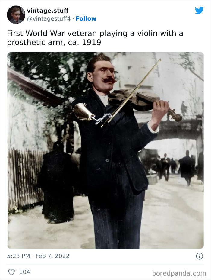First World War veteran with a prosthetic arm playing violin in a colorized photo that makes history look stunning.