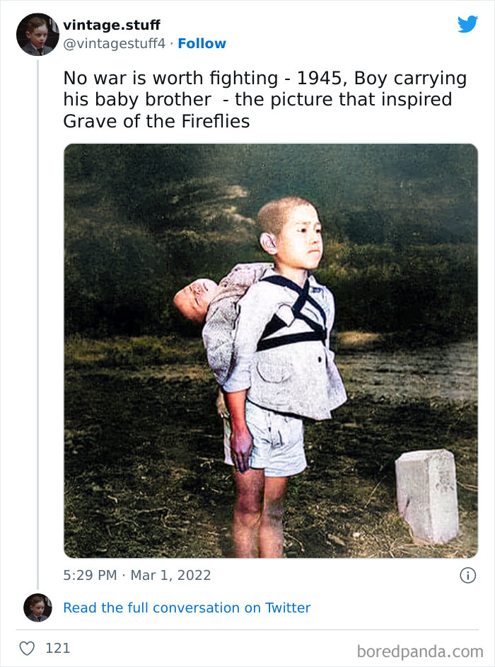 Colorized photo of a young boy carrying his baby brother, depicting a powerful historical moment from 1945.