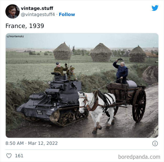 Colorized photo of a 1939 rural scene with soldiers in a tank and a man riding a horse-drawn cart on a dirt road.
