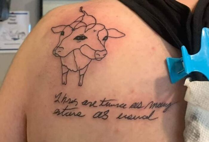 Tattoo of two-headed cow with text on shoulder, submitted to Facebook group for shaming.