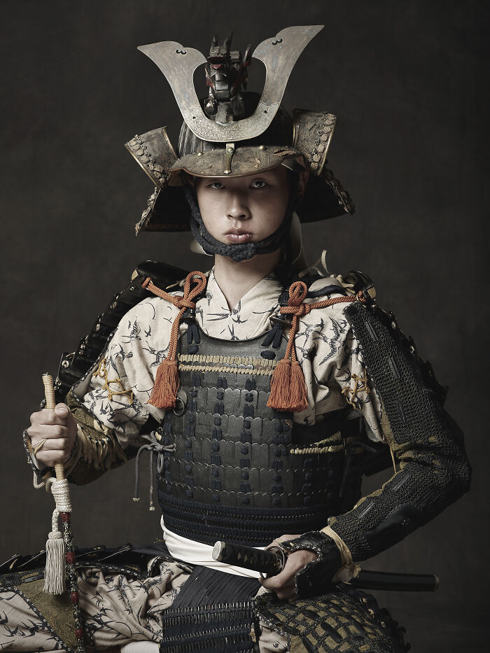 Young man in traditional samurai armor posing in a powerful portrait by photographers from around the world