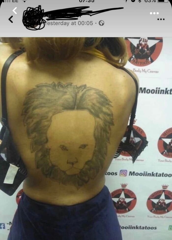 Back tattoo of a lion's face, critiqued in a Facebook group for horrible tattoos.