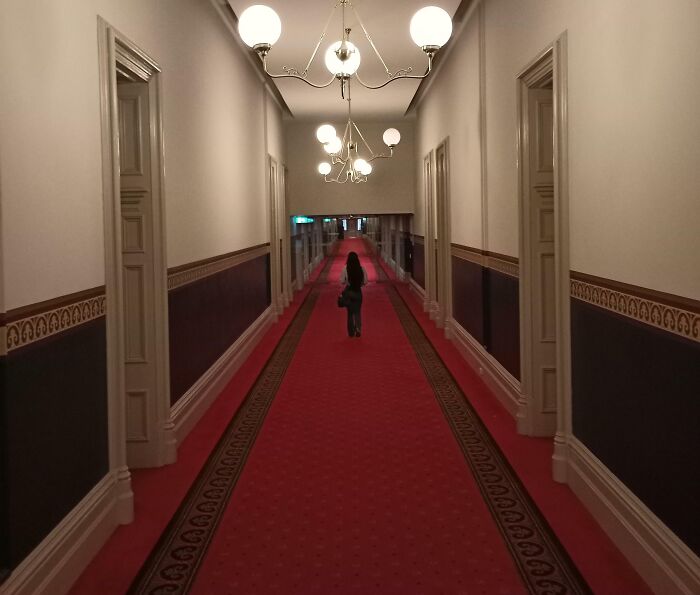 Hotel Hallway Makes Her Look Tiny