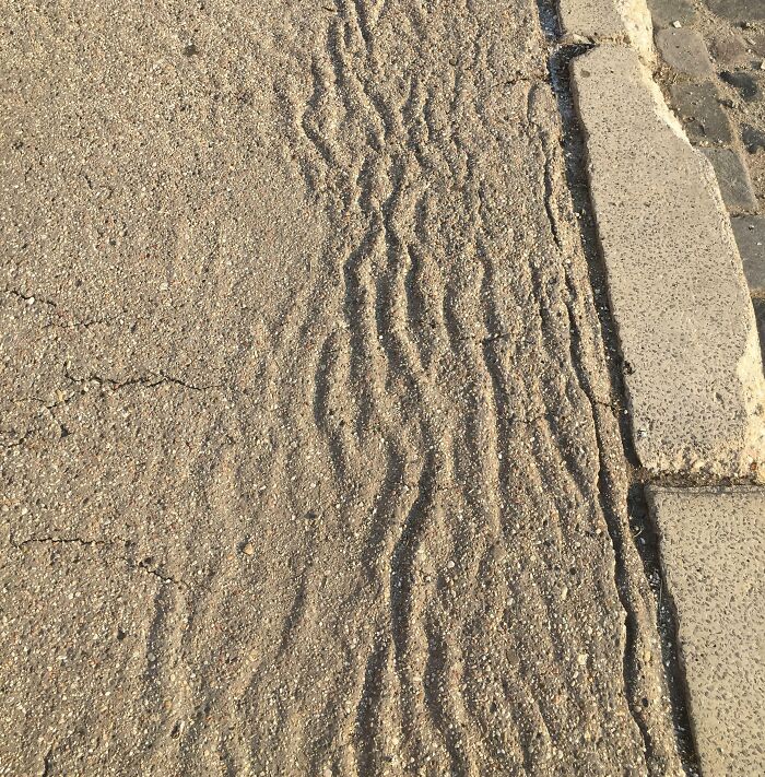 The Heat Caused Waves On The Asphalt Sidewalk