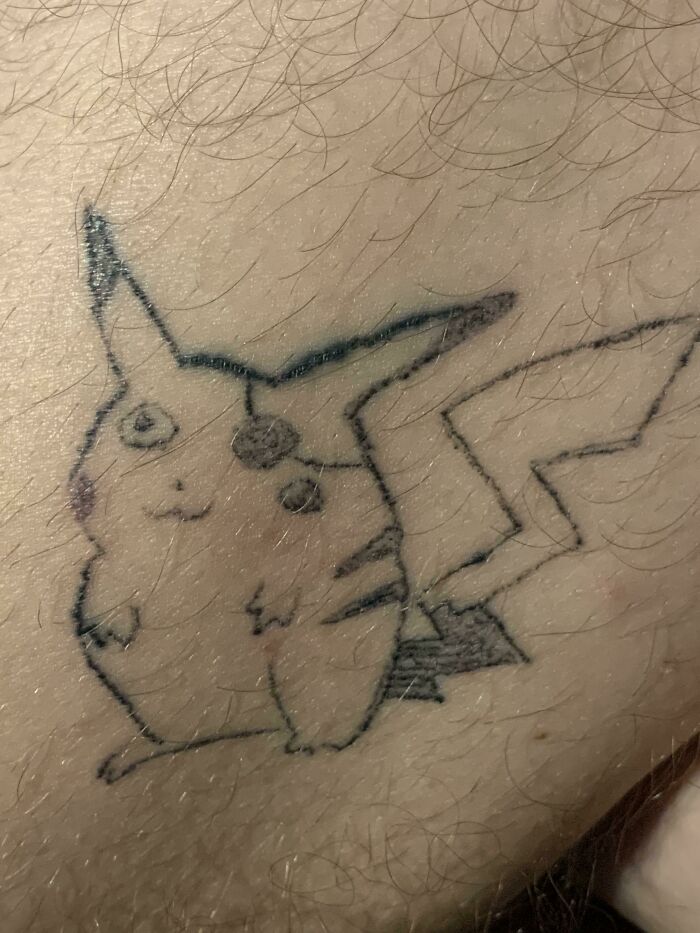 Poorly drawn Pikachu tattoo on skin, showcasing one of the worst tattoos seen online.