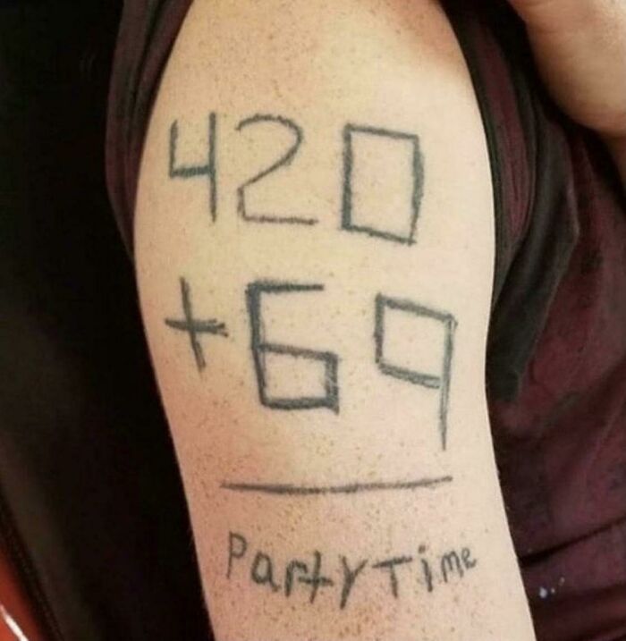 Arm tattoo with numbers and "party time," illustrating one of the worst tattoos shared online.