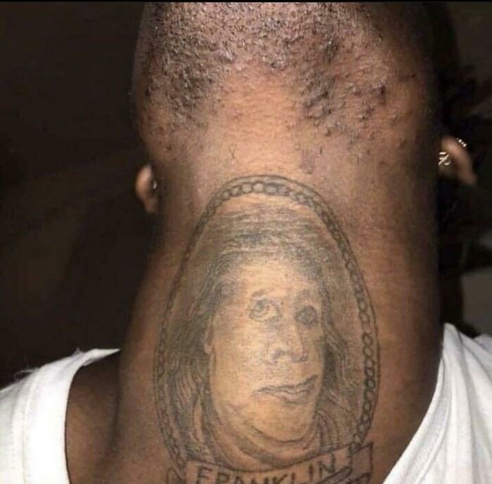 Unusual neck tattoo depicted as a portrait, shared in an online group about worst tattoos.