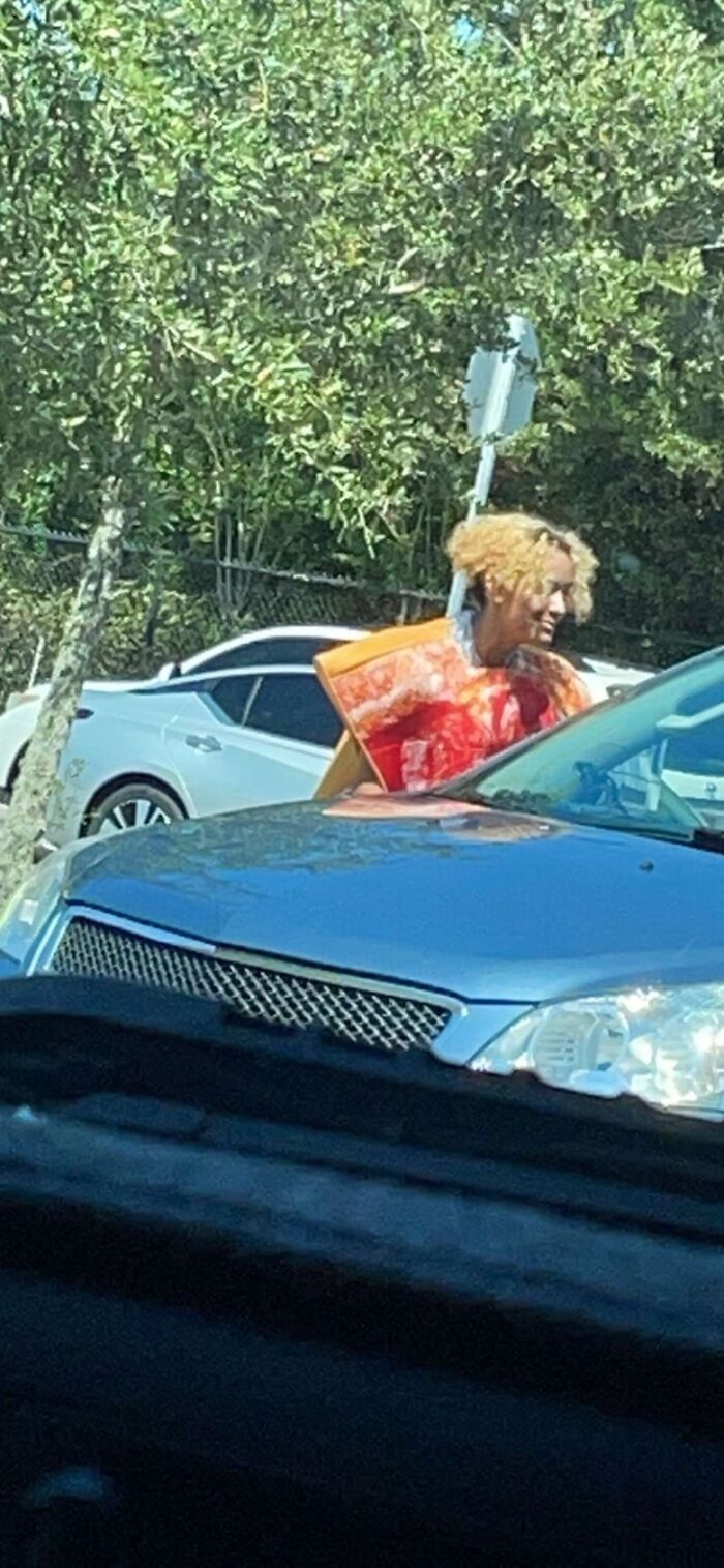 I Was Holding A Sign For Pizza Night For My School