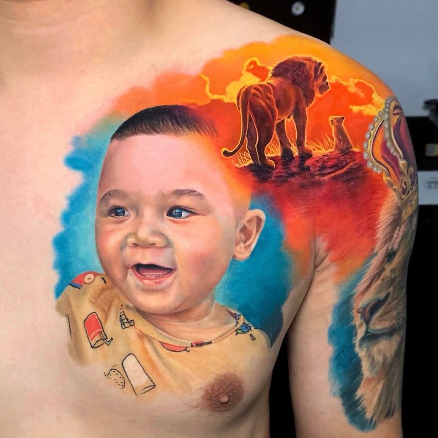 Hyper-realistic tattoo showing a baby and lion on a person's shoulder, blending vibrant colors seamlessly.