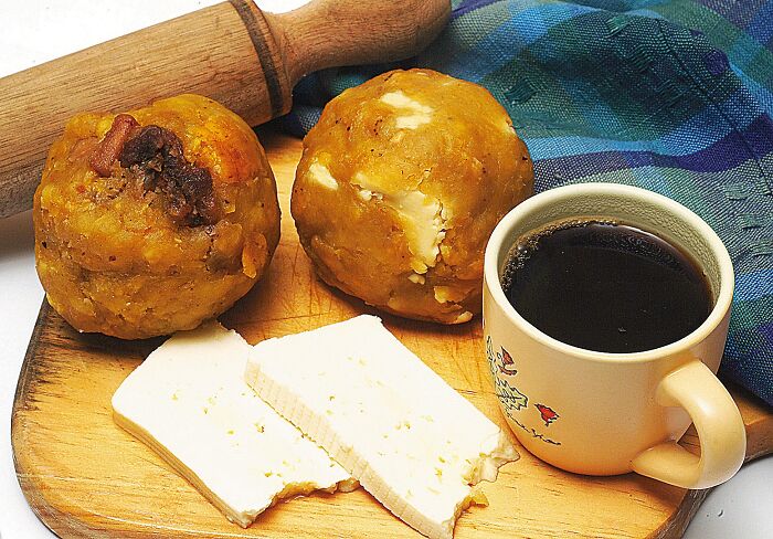 From Guayaquil, Ecuador, South America "Bolón Con Café"(Roughly : Big Plantains Balls With Coffee)
