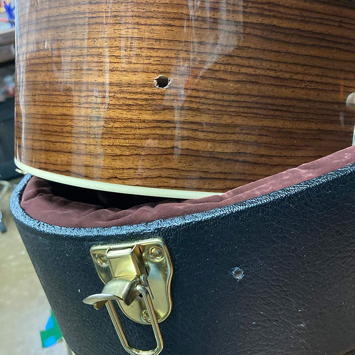 When Your Cable Guy Drills A Hole In The Side Of Your House, Into A Closet, Through A Guitar Case, And Right Through Your Martin HD-28V