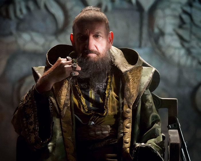 The Mandarin sitting and looking from Iron Man 3