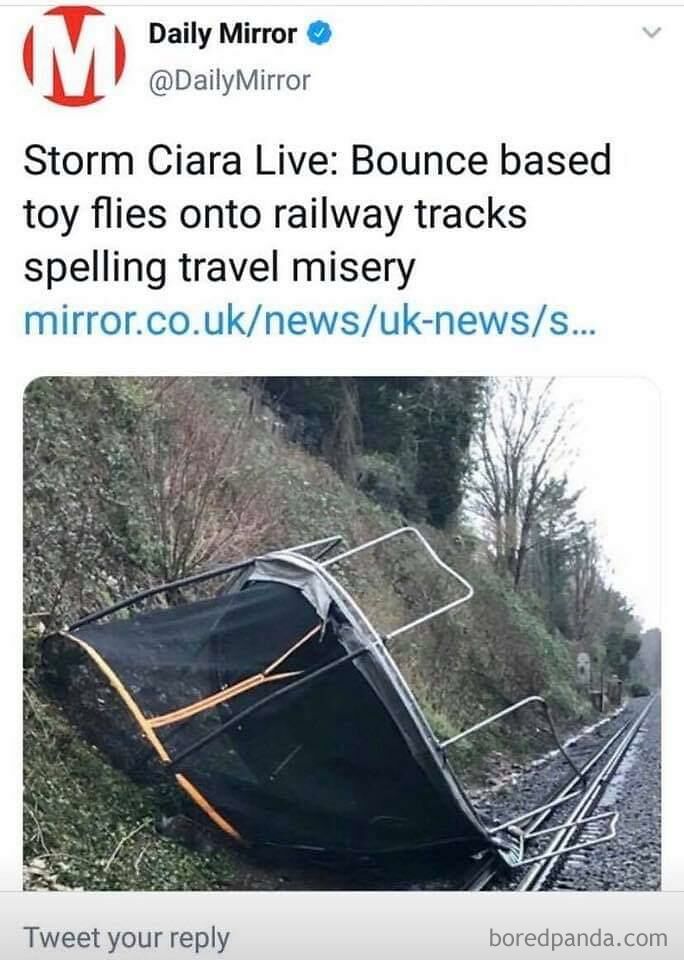 Trampoline on railway tracks after storm, described humorously as "bounce based toy," highlighting funny failure.