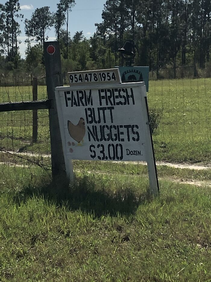 Sign advertising "Farm Fresh B**t Nuggets" at $3.00, showcasing a humorous alternative naming.