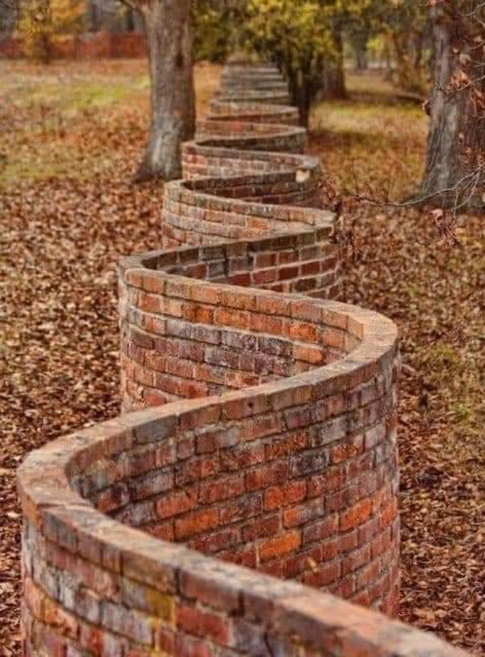 Popularized In England, These Wavy Walls Actually Use Fewer Bricks Than A Straight Wall